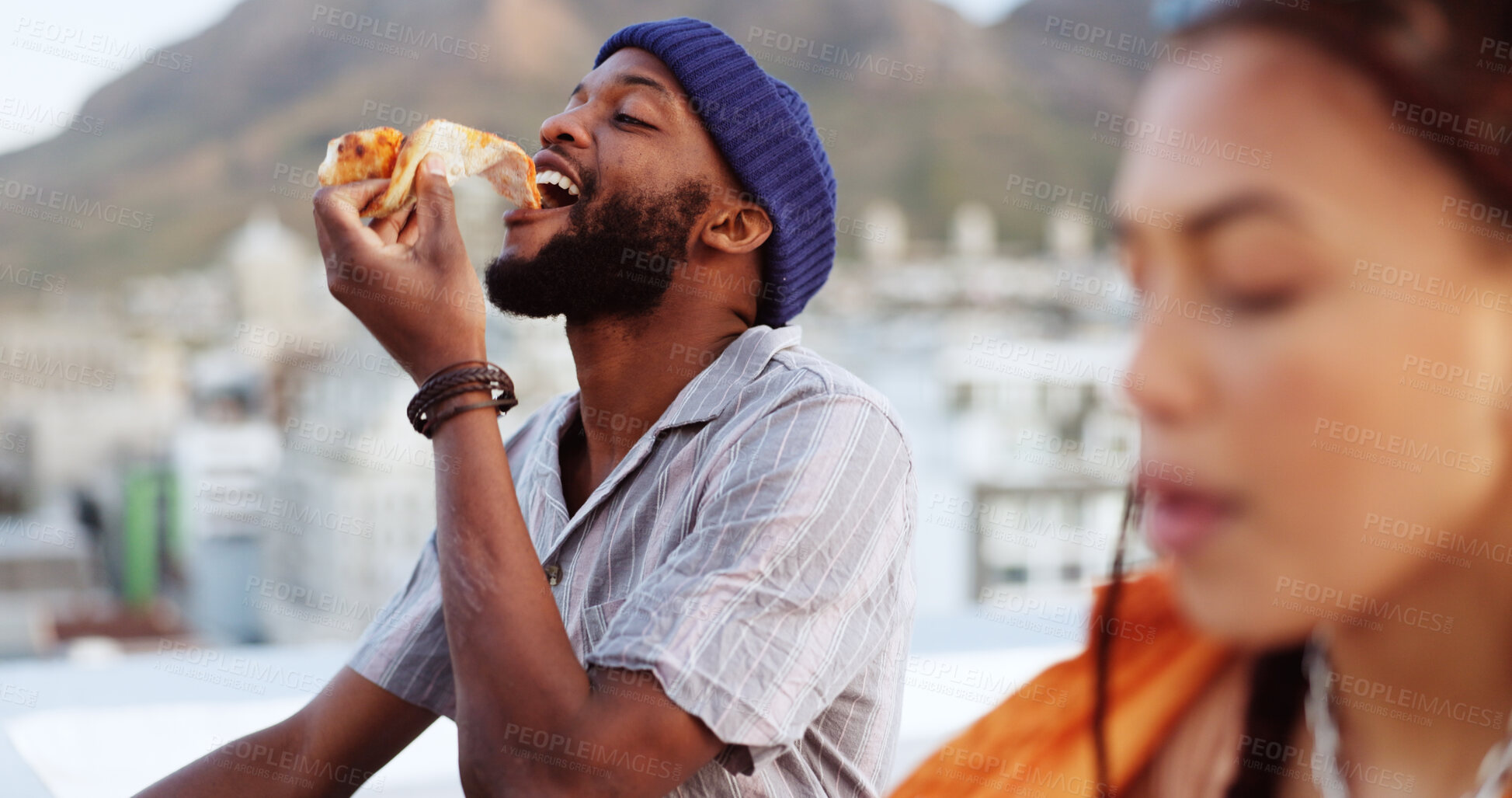 Buy stock photo Black man, eating food and pizza outdoor in city for rooftop date, bite and happiness. Couple of friends together for travel, urban freedom or relax and excited for adventure while hungry in Rome