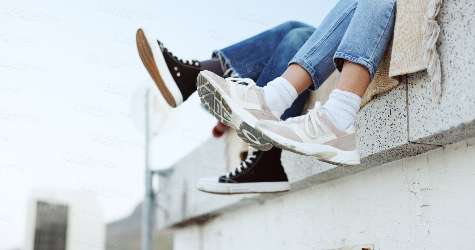 Buy stock photo Shoes, legs and couple on rooftop in the city sitting together, having fun or bonding. Fashion sneakers, roof and man and woman kick feet on building, enjoy weekend or freedom in urban town outdoor