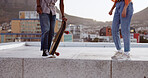 Skateboard, friends and city with a man and woman skating on a rooftop outdoor during the day. Sport, exercise and summer with a male and female training as a street skater in an urban town