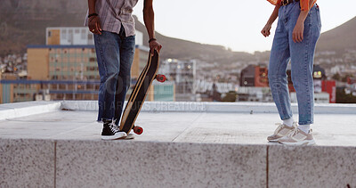 Skateboard, friends and city with a man and woman skating on a rooftop outdoor during the day. Sport, exercise and summer with a male and female training as a street skater in an urban town