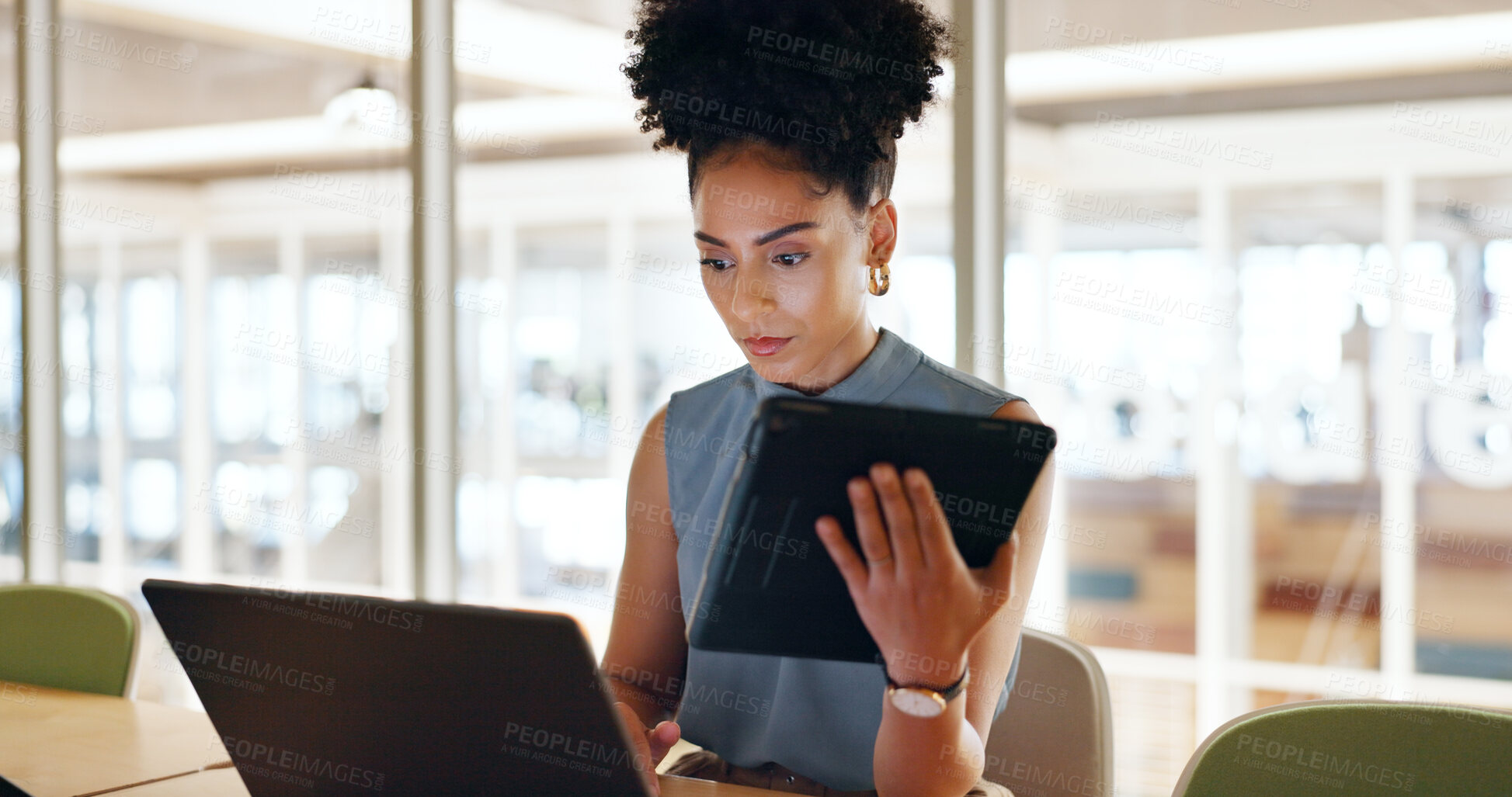 Buy stock photo Laptop, business tablet and serious woman at table to research information in creative startup office. Technology, professional designer on computer at desk, networking and typing email on internet