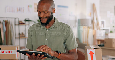 Tablet, creative and online order with a black man designer working in a workshop for shipping or delivery. Computer, ecommerce and logistics with a male managing stock or the shipment of goods