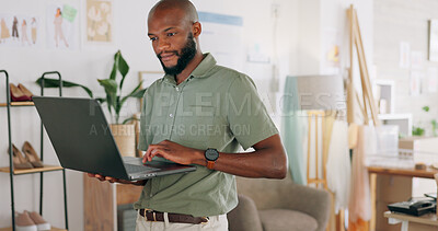 Laptop, creative and online order with a black man designer working in a workshop for shipping or delivery. Computer, ecommerce and logistics with a male managing stock or the shipment of goods