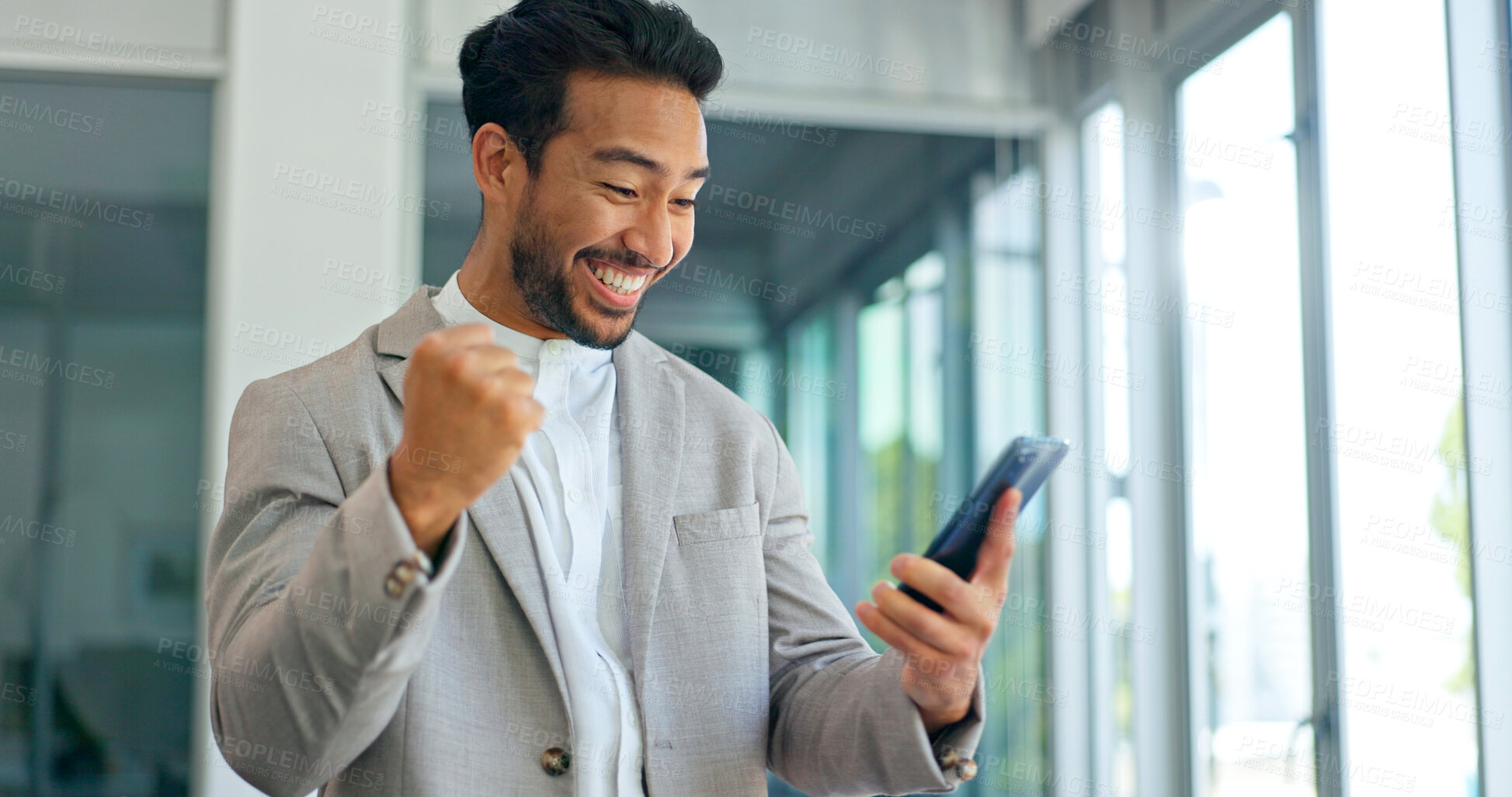 Buy stock photo Success, excited and phone of business man in office for good news or yes feedback. Celebrate, winning and fist of asian male employee with smartphone for wow achievement, promotion or online bonus