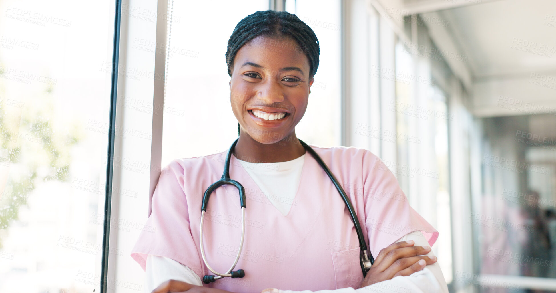 Buy stock photo Nurse in portrait, black woman with arms crossed and healthcare, smile with confidence at hospital with pride and help. Medical professional, trust and expert at clinic with scrubs and medicine