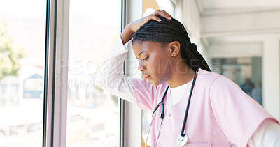Nurse, stress thinking and hospital window for relax breathing, stress relief and healthcare worker frustrated or overworked. Black woman, employee burnout and anxiety headache working in clinic
