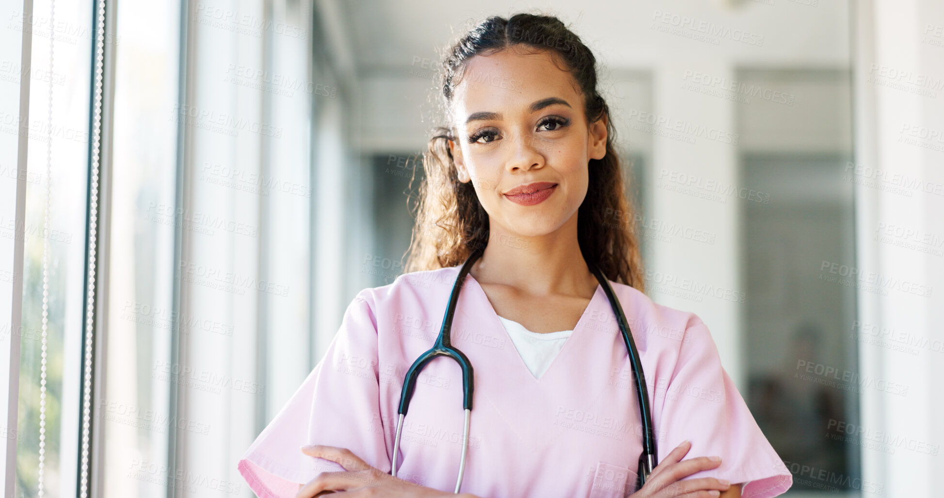 Buy stock photo Nurse in portrait, woman with arms crossed and healthcare, smile with confidence at hospital with pride and help. Medical professional, trust and caregiver at clinic with scrubs and medicine