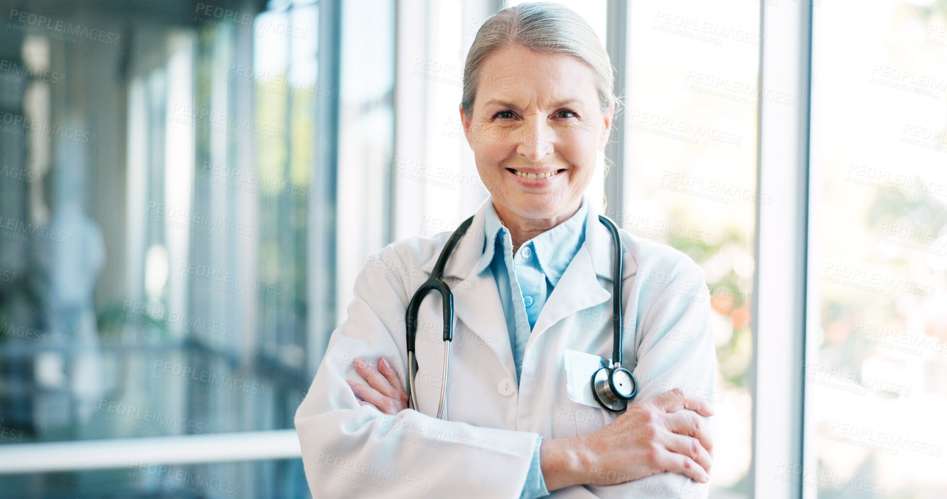 Buy stock photo Doctor in portrait, senior woman with arms crossed and healthcare, smile with confidence at hospital with pride and help. Medical professional, trust and expert at clinic with pride and medicine