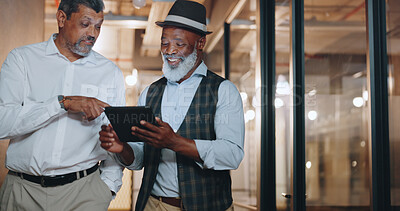 Partnership, tablet and businessmen walking in the office analyzing, talking and planning a project. Technology, professional and senior male employees working on a mobile device in the workplace.