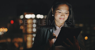 Buy stock photo Tablet, night and networking with a business asian woman on an office balcony for planning or overtime. Technology, research and a happy young employee working late in the evening on a project