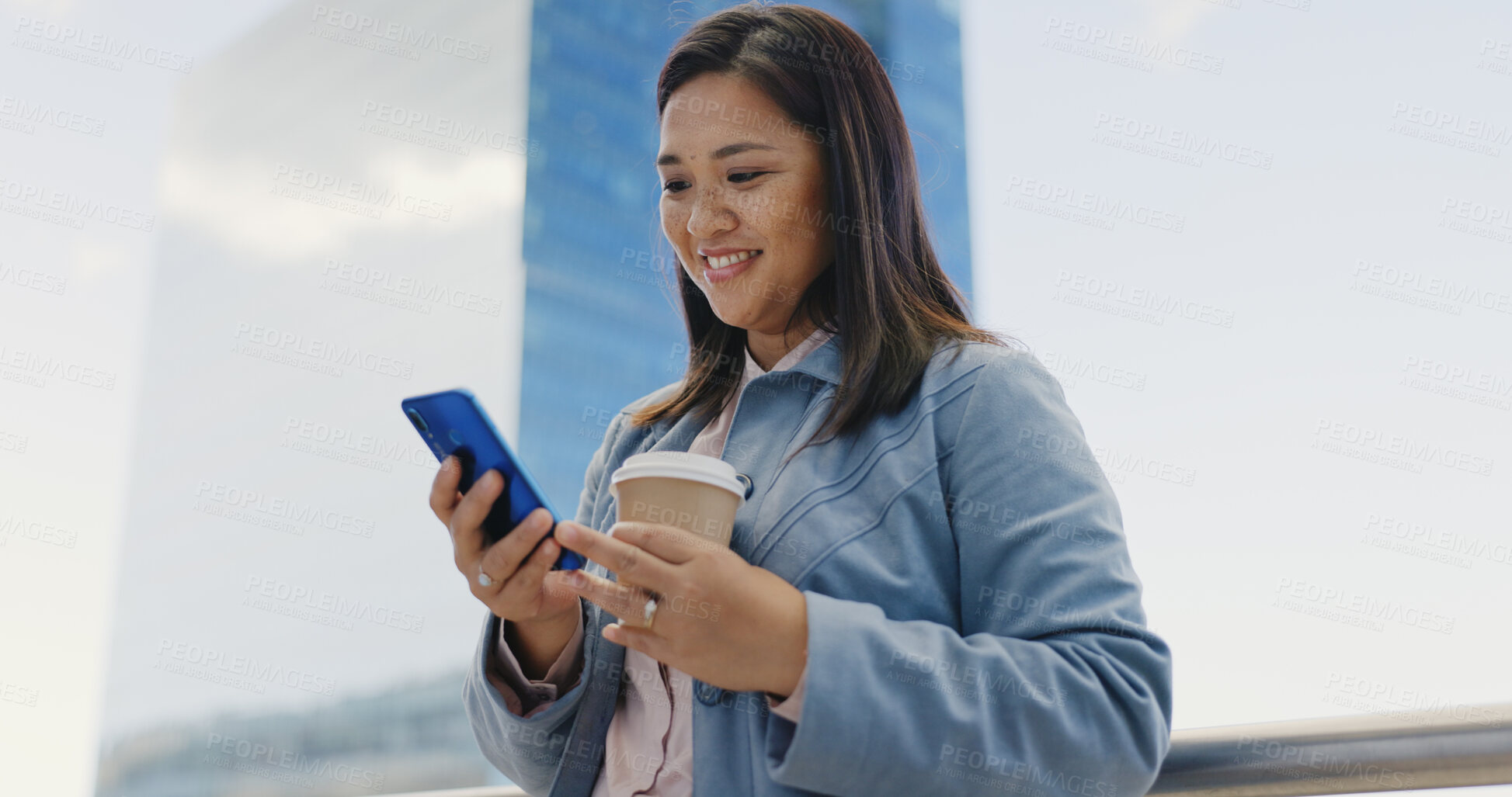 Buy stock photo Phone, coffee and Asian businesswoman in the city walking to work typing a corporate email. Happy, smile and young Japanese female lawyer scroll on cellphone commuting with latte in urban town street