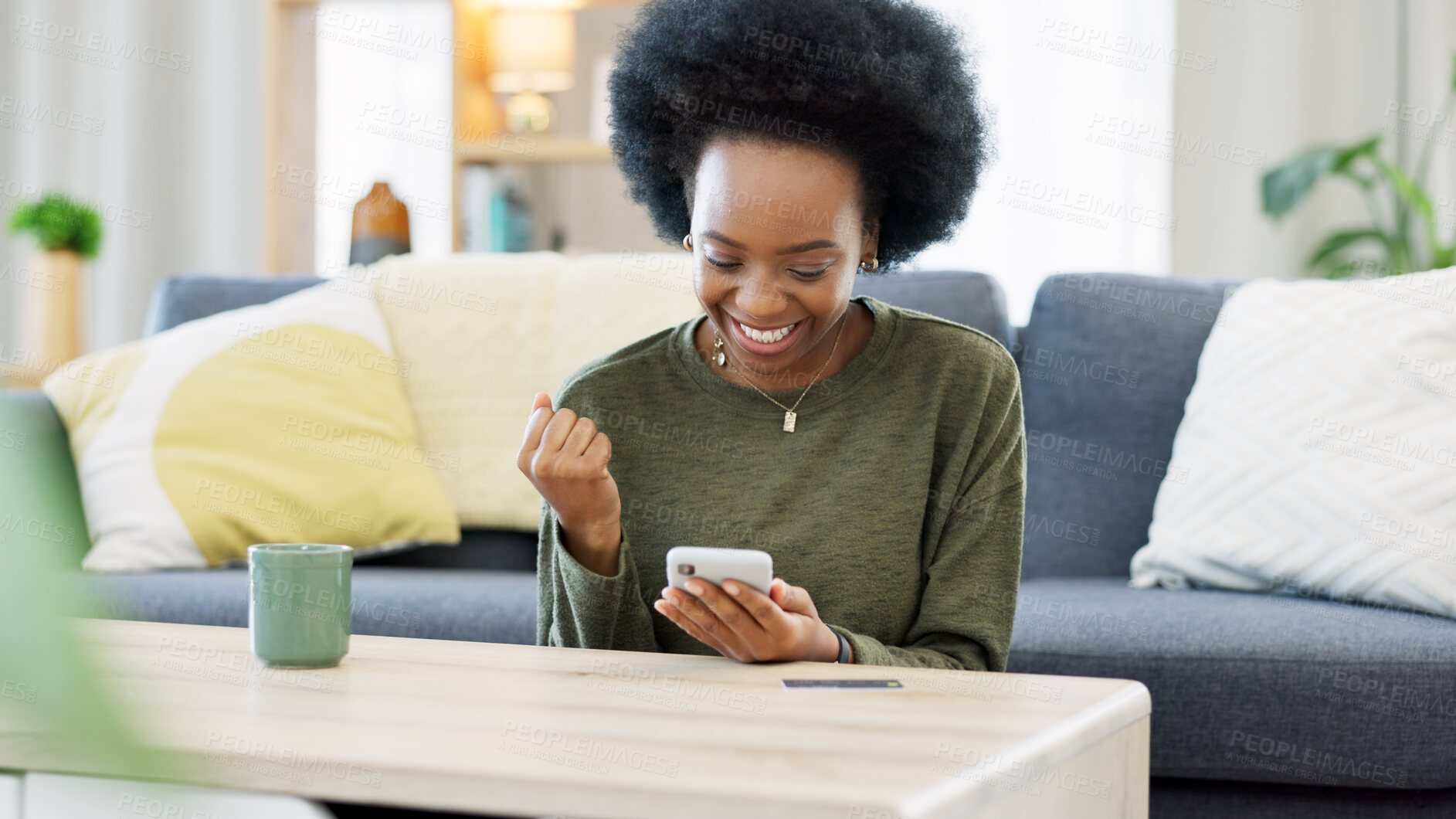 Buy stock photo Woman, winner and phone for home news, email communication or social media competition in living room. African person or mobile user with fist, yes and excited of prize, giveaway or apartment success