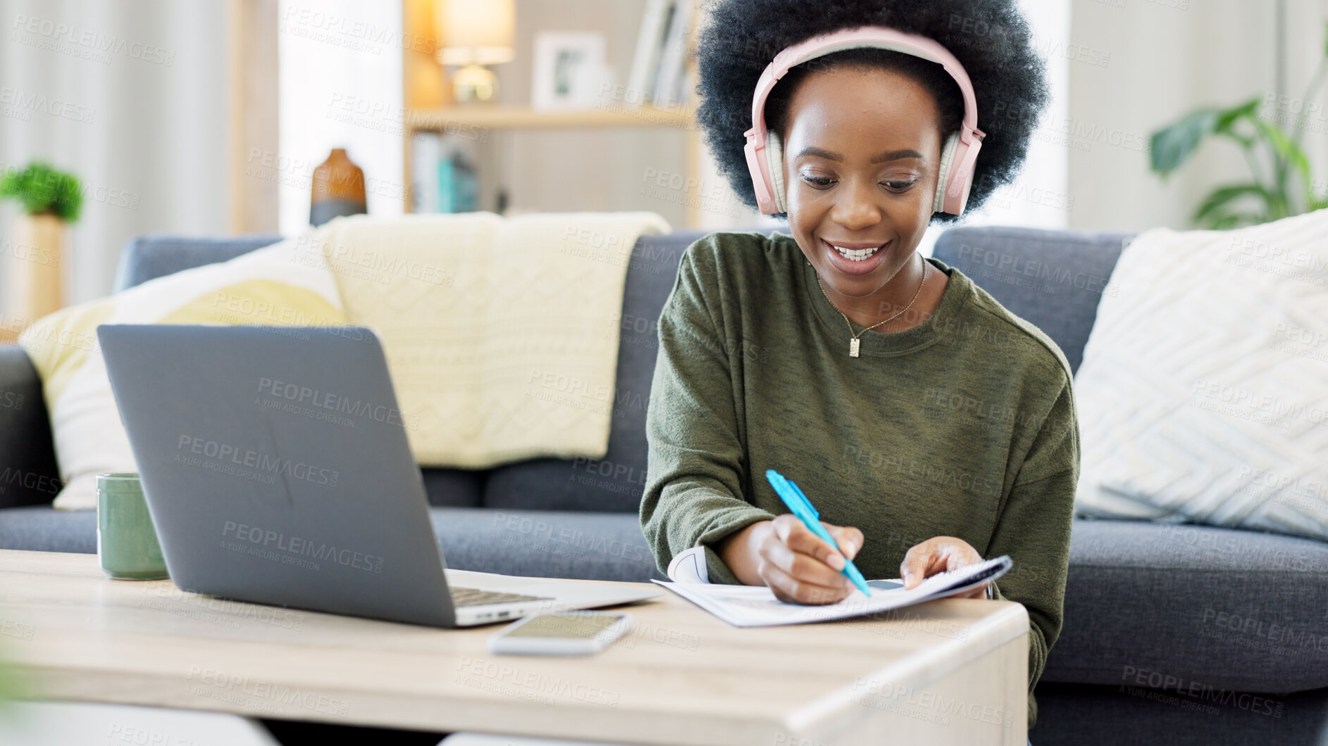 Buy stock photo Woman, student writing and headphones for home education, e learning and studying on her laptop. African person with notes, phd research proposal and planning goals on computer and listening to music