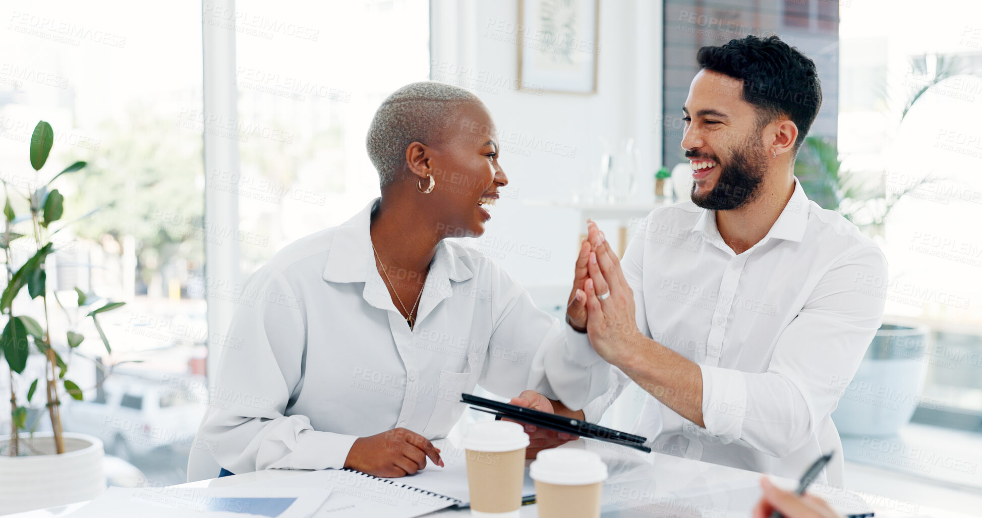 Buy stock photo Tablet, teamwork and business people high five, happy in office for success and achievement of target. Technology, hands together and celebration of goal in meeting, winner of bonus and funny laugh