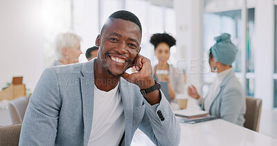Meeting, office and face of a professional black man sitting at a table with a corporate team. Happy, smile and portrait of African businessman working on company project with colleagues in workplace