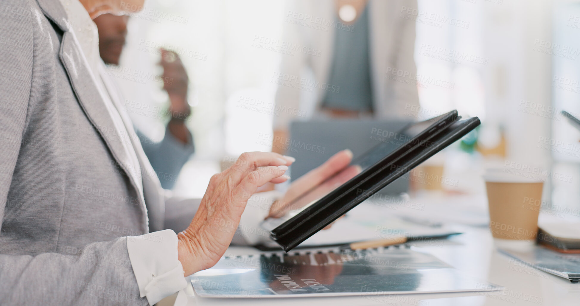 Buy stock photo Business person, hands and tablet in research, meeting or networking at team conference or office. Closeup of employee working on technology for communication, internet or browsing app at workplace