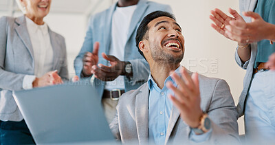 Business people, celebration and applause for man on laptop in office. Success, congratulations and group of staff clapping to celebrate goals, targets or achievements with happy employee on computer