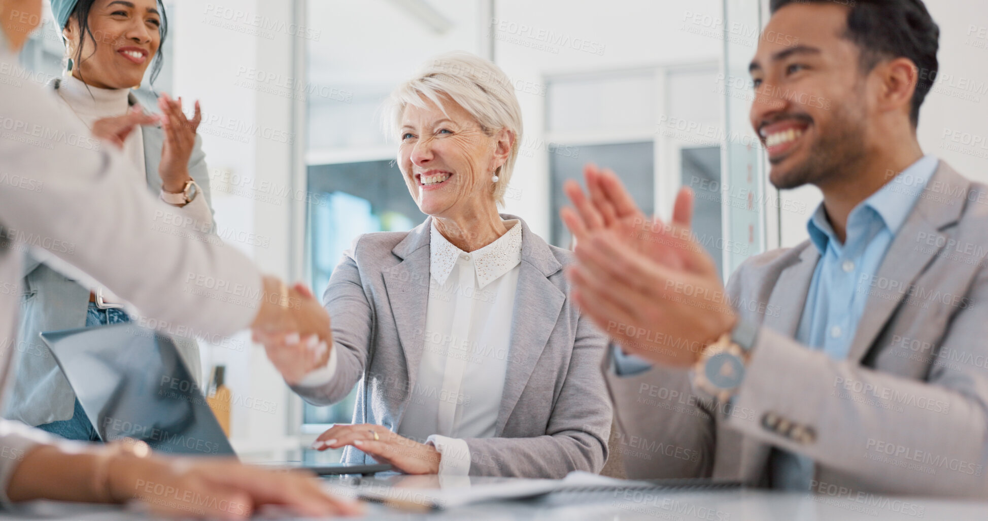 Buy stock photo Happy business people, handshake and applause in celebration, hiring or meeting together at office. Group of employees shaking hands, clapping and partnership for b2b, deal or recruiting at workplace