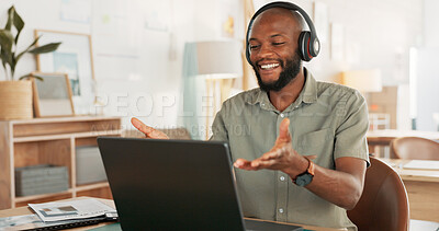 Laptop, headphones and black man on an online video call or meeting for his remote corporate job. Happy, talking and African guy on a webinar, video conference or seminar call with a computer at home