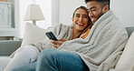 Happy, couple with phone for communication, networking or social media app at home. Movie, video or love man and woman relax in living room streaming online, internet or website with smile in house