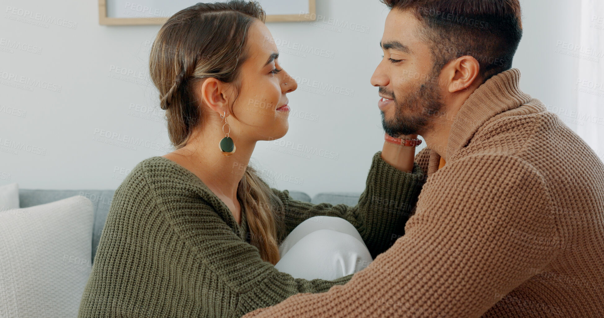 Buy stock photo Love, support and happy with couple in their home together, intimate moment and communication. Smile, relax and romance with a young man and woman with care on a sofa in the living room in marriage