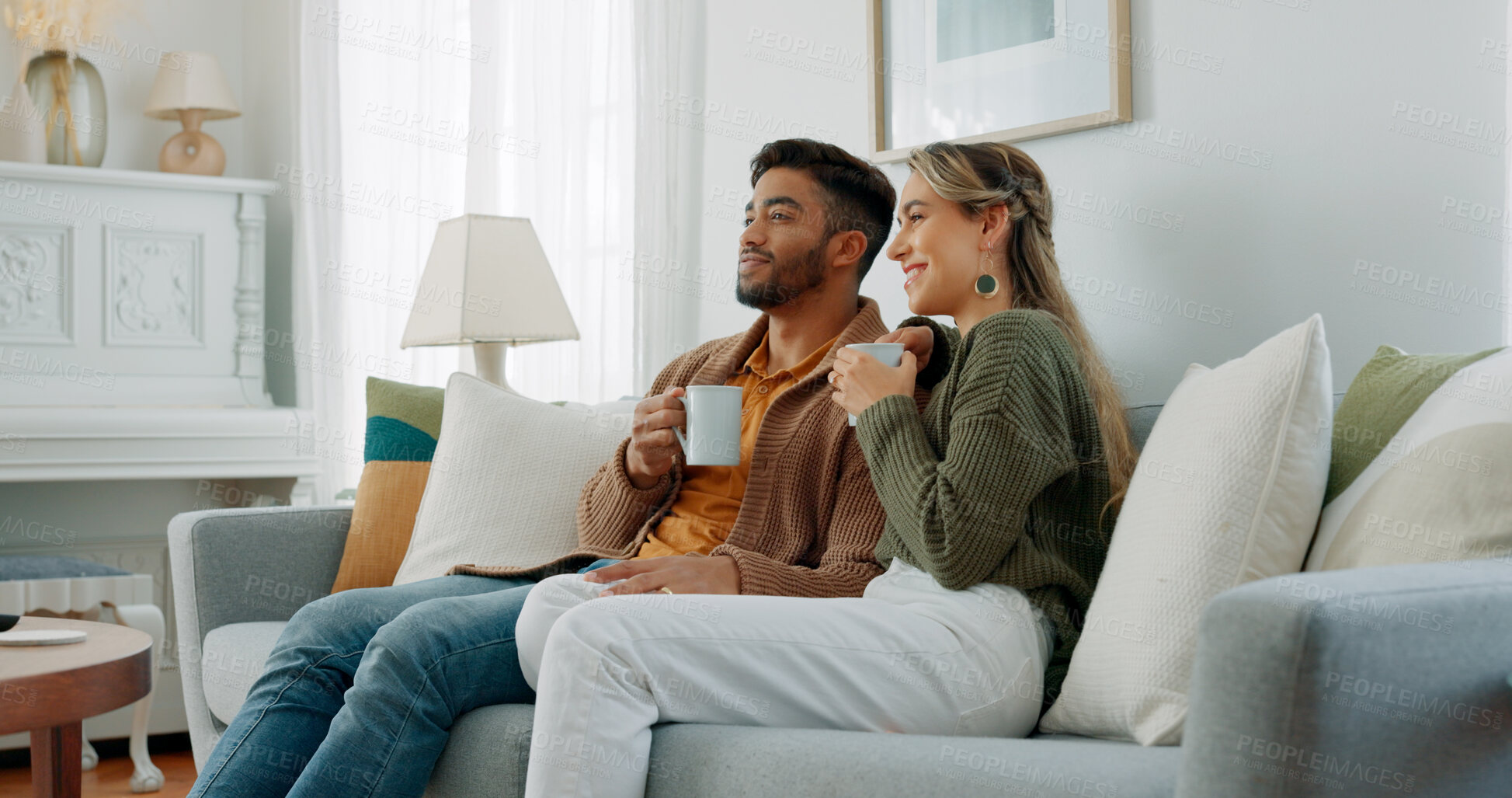 Buy stock photo Relax, coffee and a couple watching tv in their home together for streaming in the morning. Love, smile or happy with a man and woman on a living room sofa for bonding or subscription entertainment