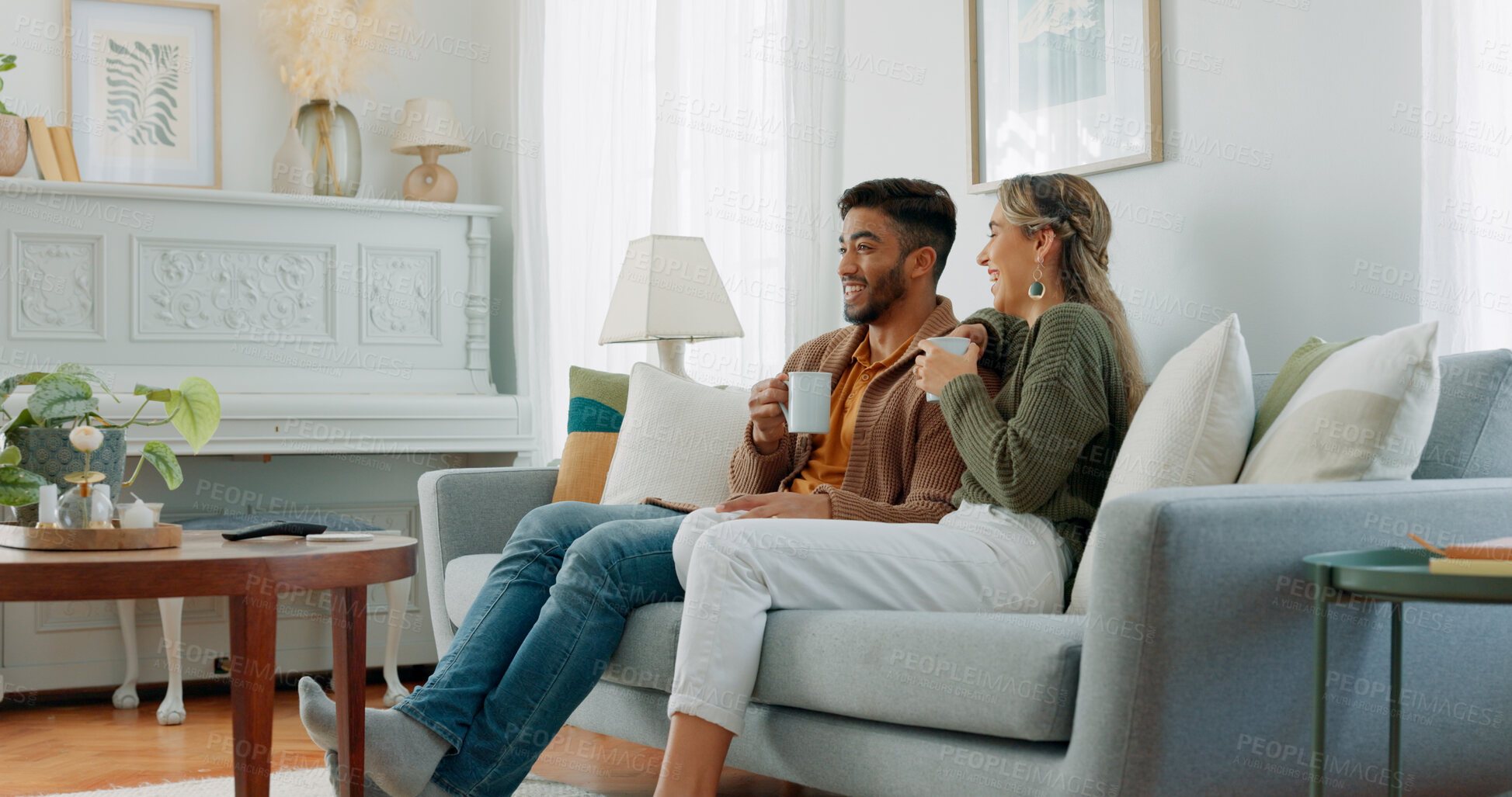 Buy stock photo Relax, coffee and a couple watching tv in the living room together for streaming in the morning. Love, smile or happy with a man and woman on a sofa at home for bonding or subscription entertainment