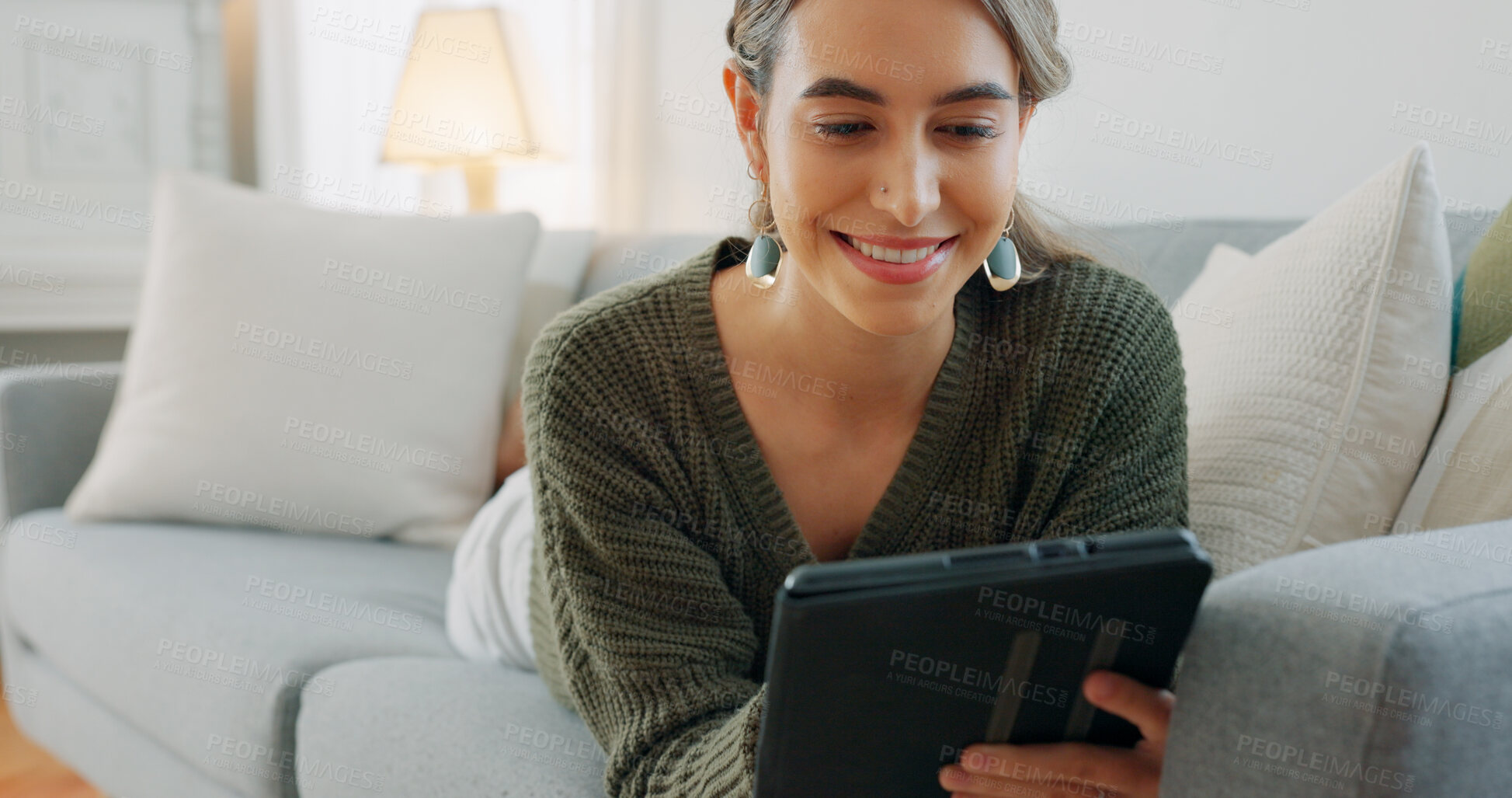 Buy stock photo Happy woman relax on sofa with tablet, scroll and search on social media, website or email in home. Online shopping, games and girl with smile on living room couch with digital app for video download