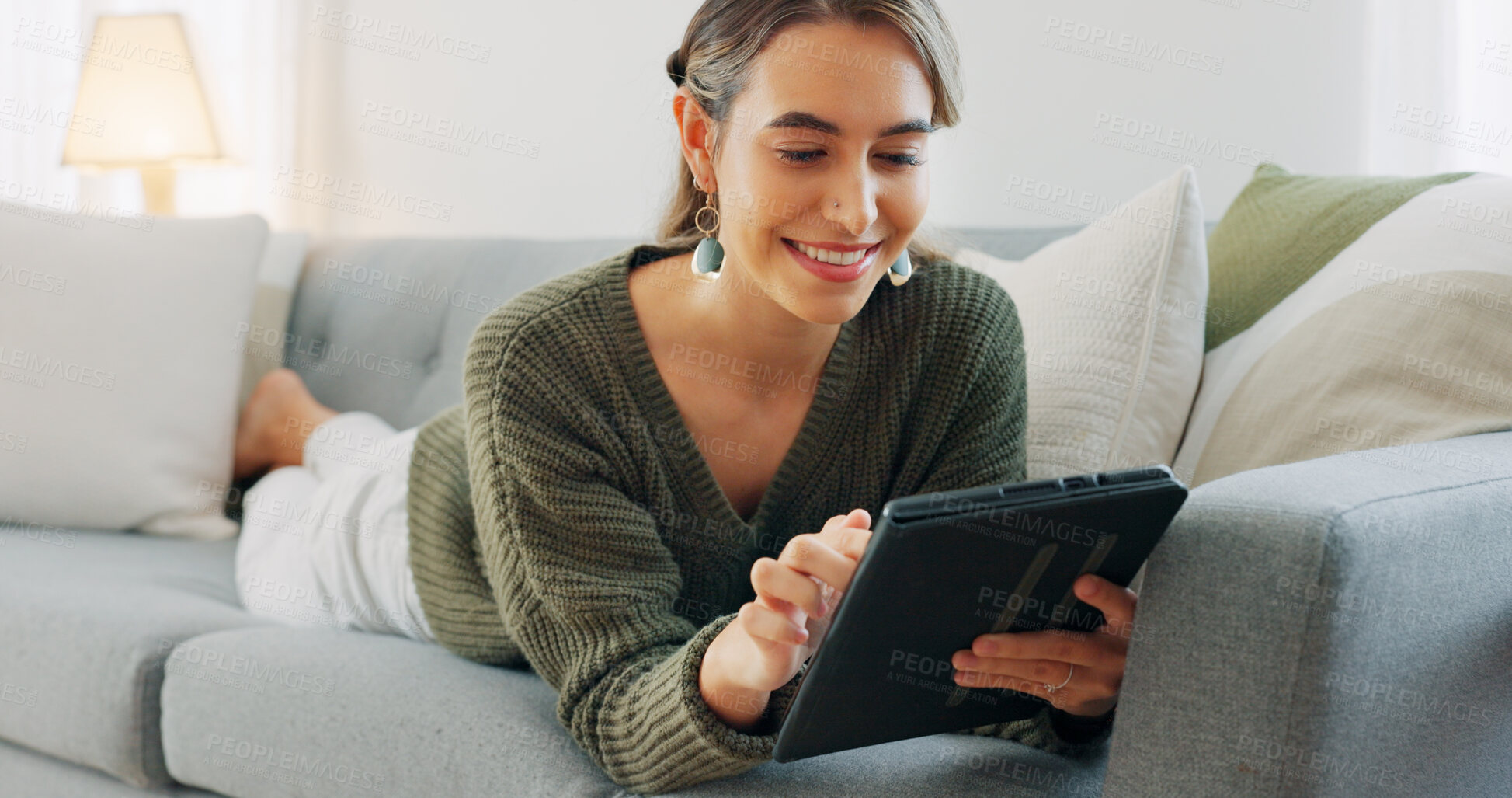 Buy stock photo Woman with smile, relax on sofa with tablet and scroll for search on social media, website or email in home. Online shopping, games and girl on living room couch with digital app for video download.