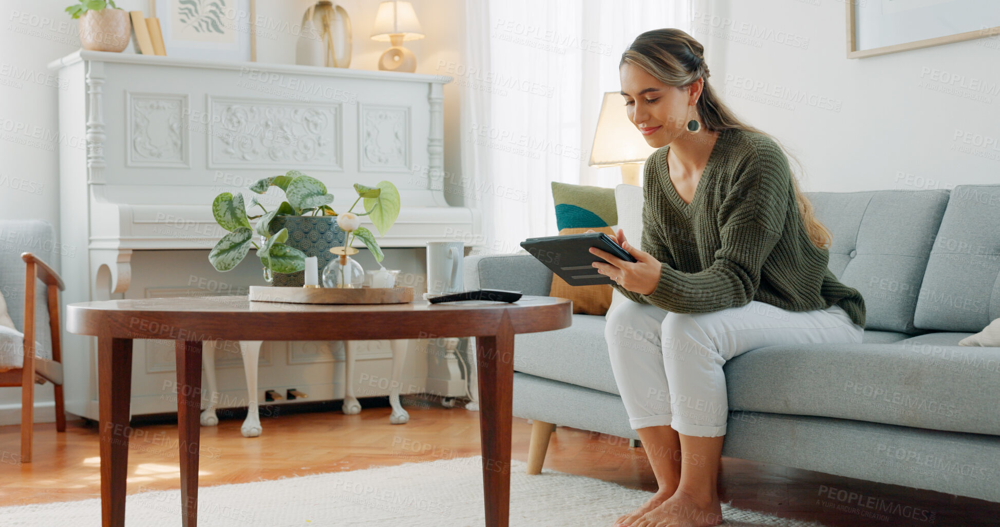 Buy stock photo Happy woman on sofa with tablet, relax and search on social media, website or email in home. Online shopping, games and girl with smile sitting living room couch with digital app for video download.