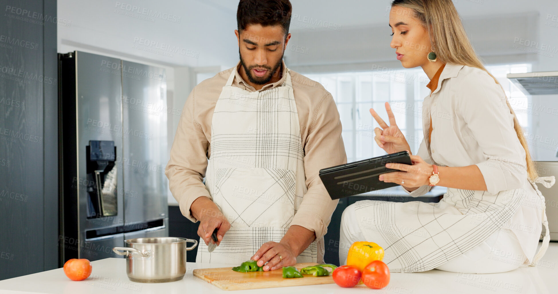 Buy stock photo Tablet, food and couple cooking in a kitchen of the home together for health, diet or nutrition. Technology, recipe or instructions for a meal with a man and woman making healthy supper for wellness