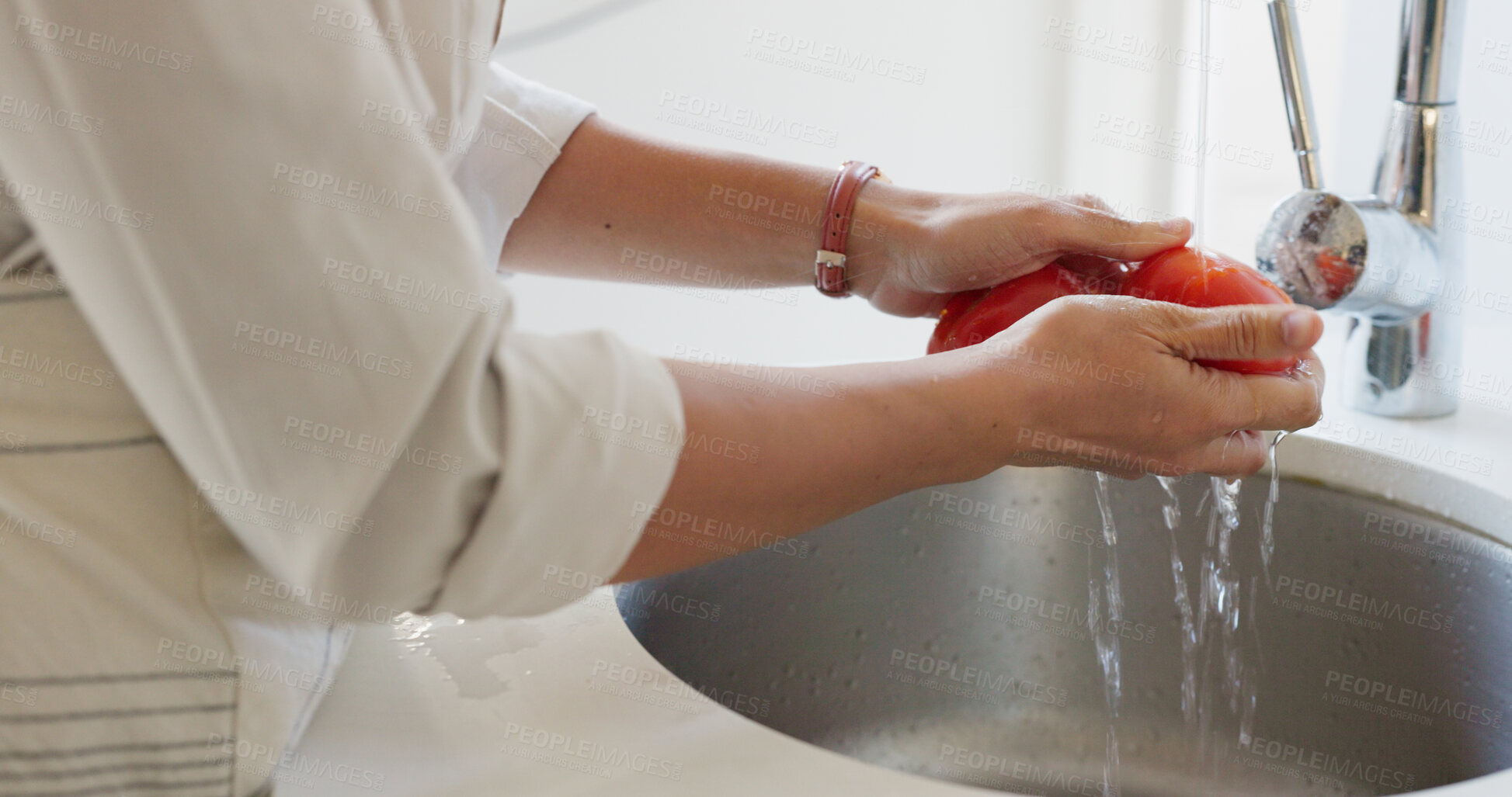 Buy stock photo Water, hands and cleaning tomato for cooking food, salad or dinner in basin of kitchen at home. Vegetables, woman and washing produce for healthy diet, lunch or nutrition with vegan lifestyle or meal