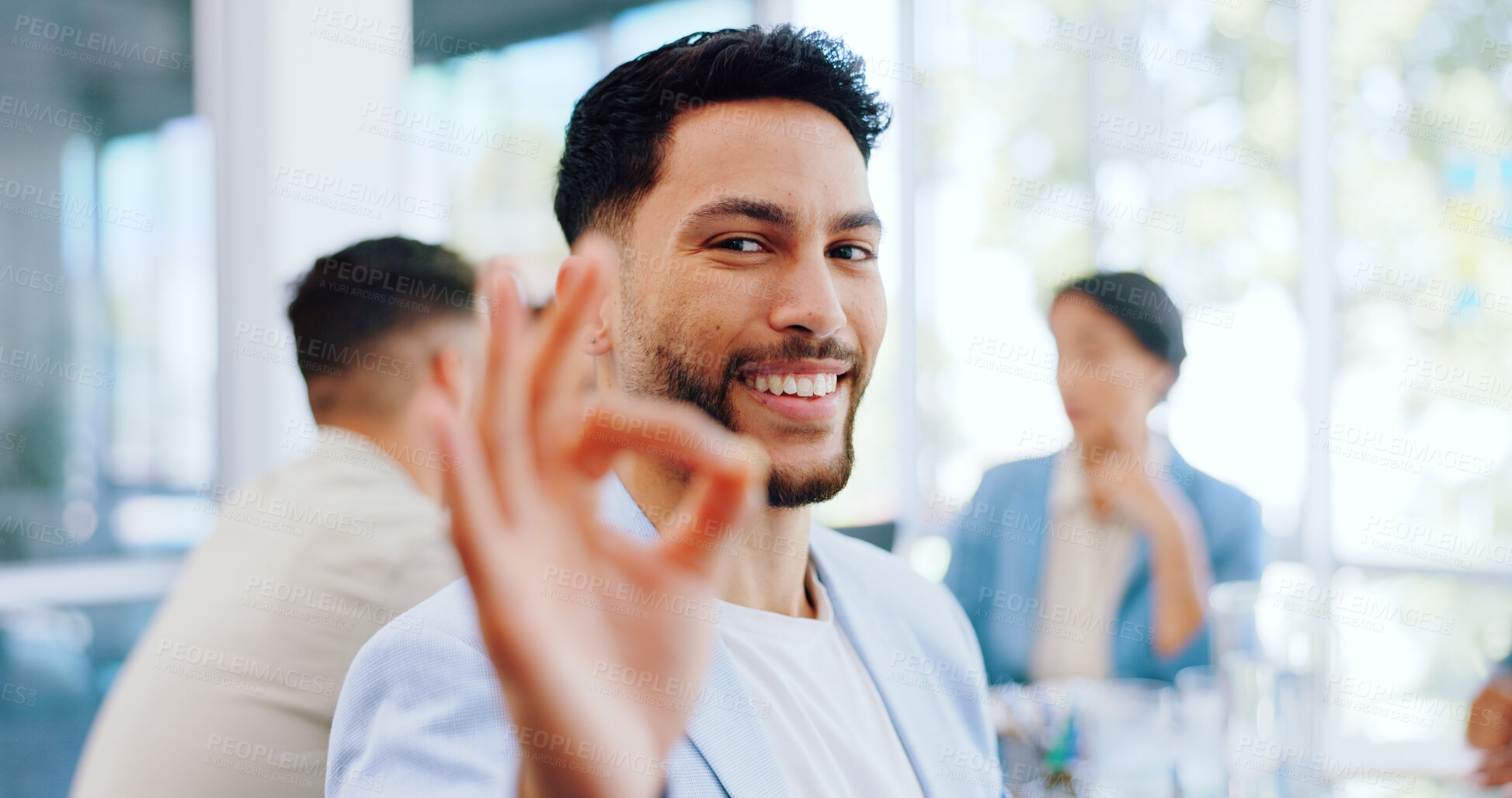 Buy stock photo Meeting, okay sign and portrait of business man in discussion, collaboration and teamwork at office. Corporate, yes emoji and face of employee with hand gesture for agreement, approval and perfect