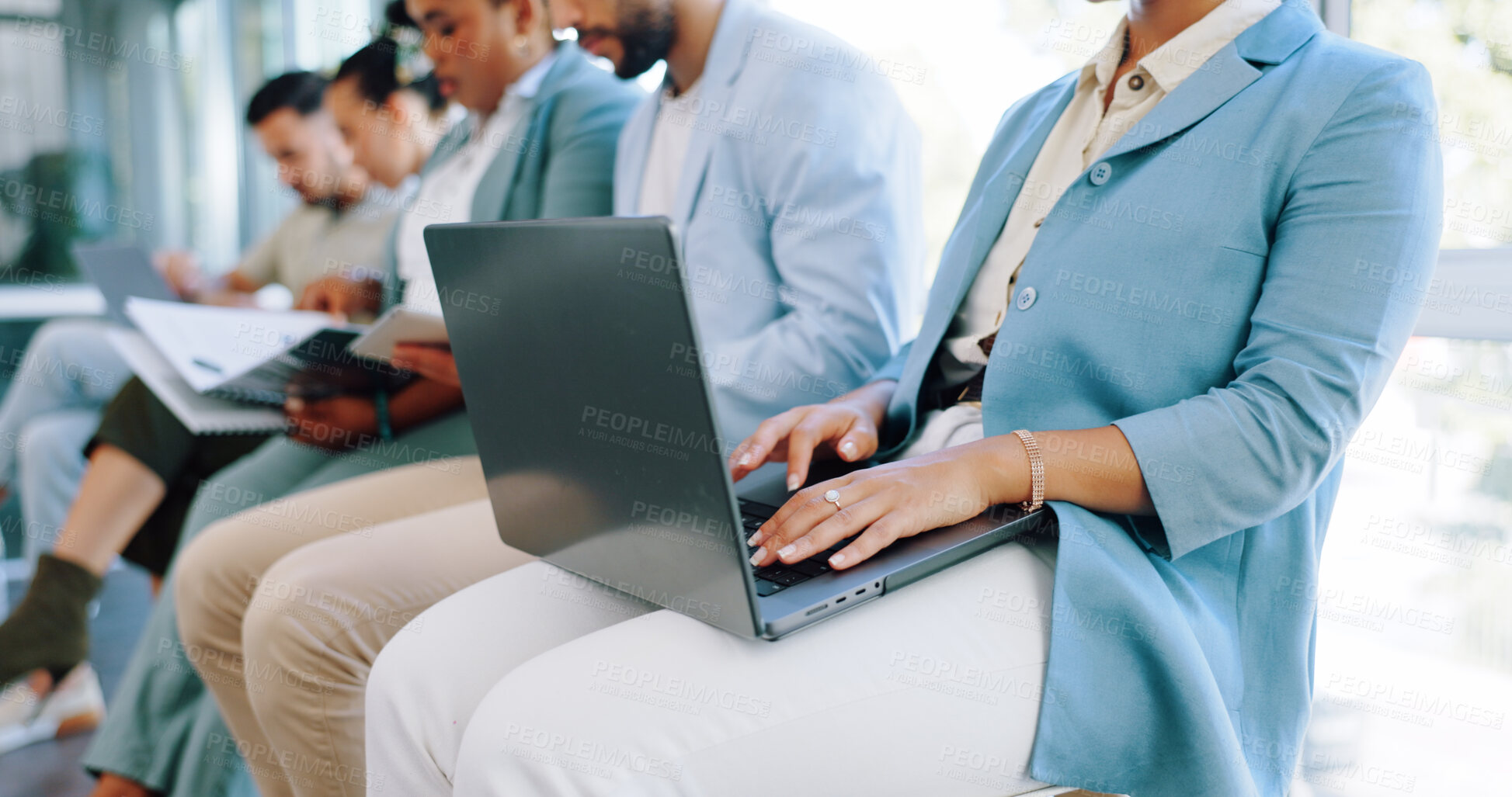 Buy stock photo Hands, laptop or waiting and a business woman in line for her hiring interview with human resources. Computer, resume and recruitment with a female candidate sitting in a row for a company vacancy