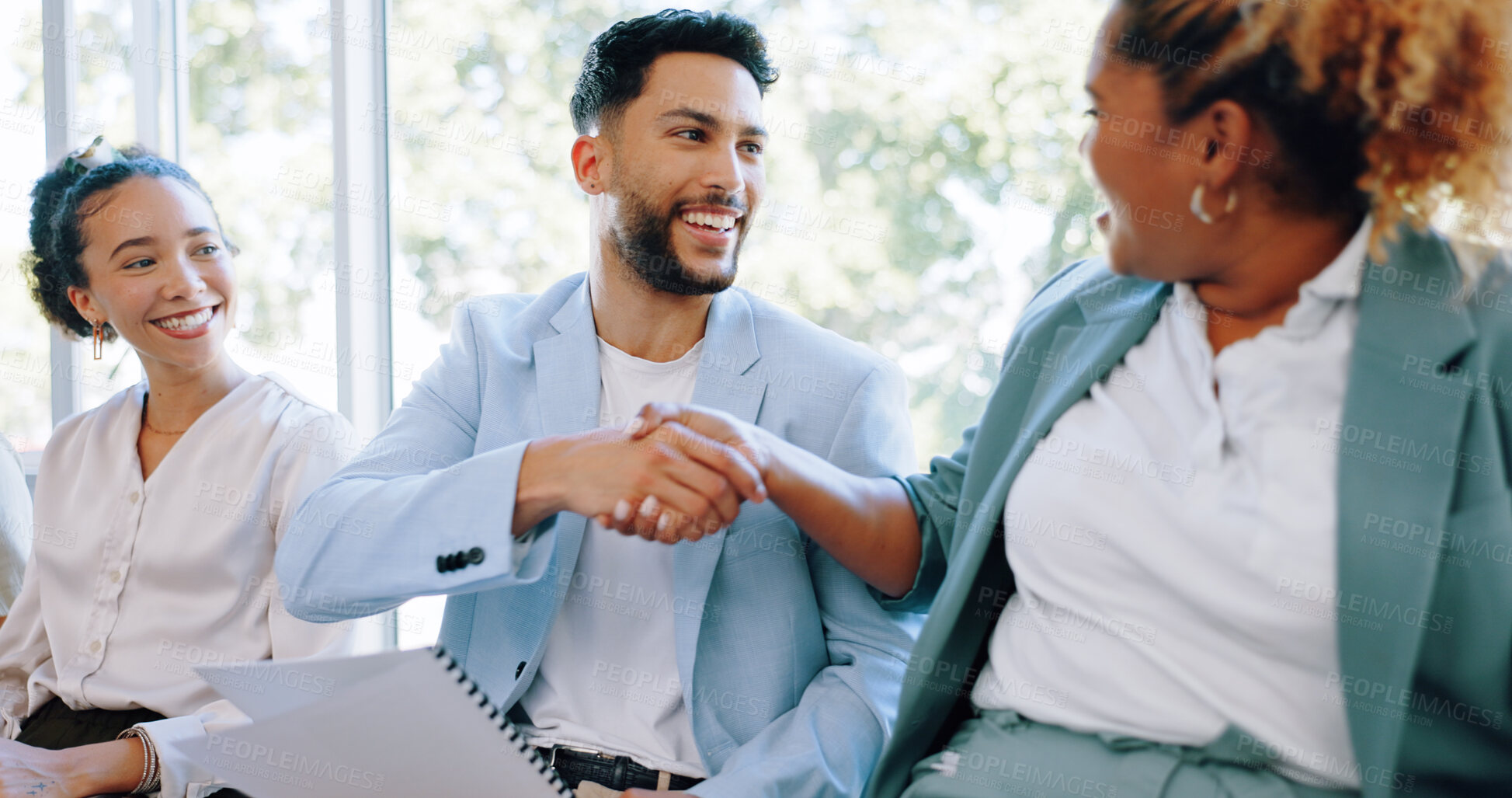 Buy stock photo Business people, handshake and meeting in waiting room, hiring or job opportunity together at office. Happy employees shaking hands in line for deal, agreement or partnership in teamwork at workplace