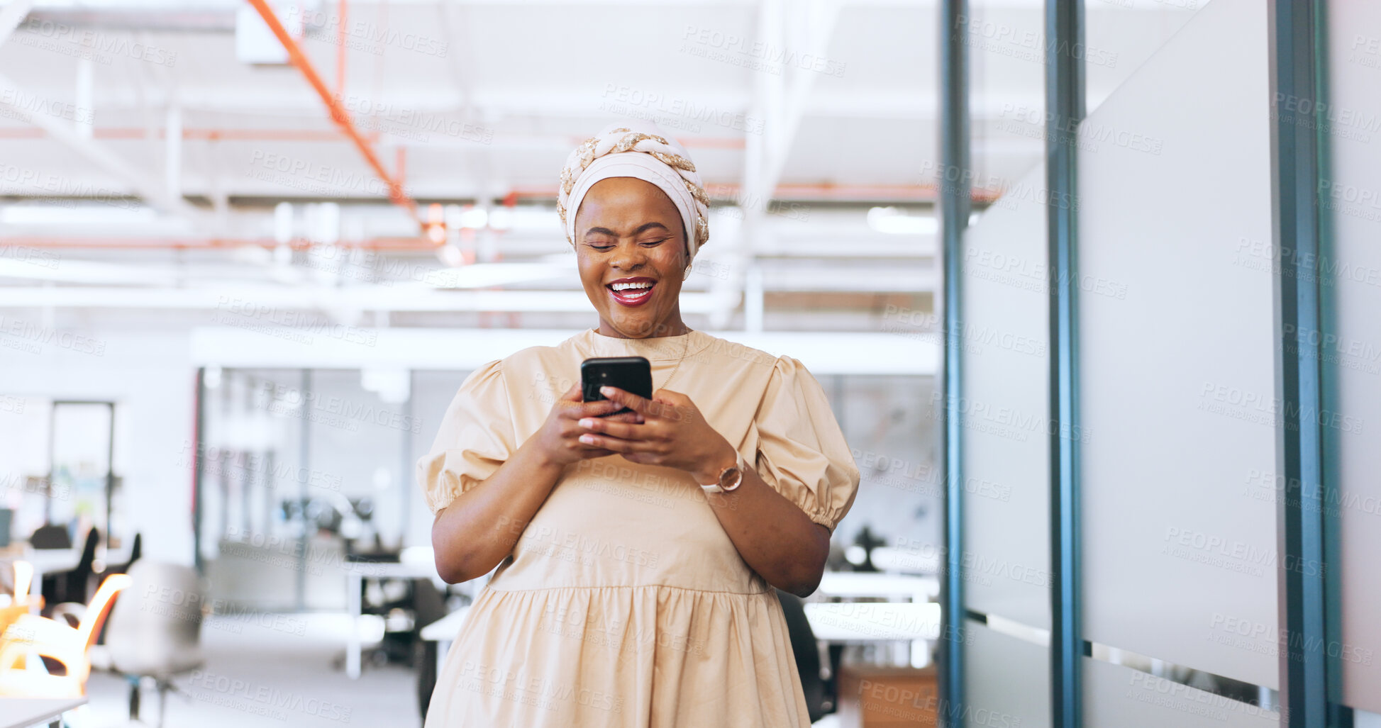 Black woman, phone and communication with a business contact while walking  in a creative office laughing about funny meme notification. Happy african  employee using mobile data on social network | Buy Stock