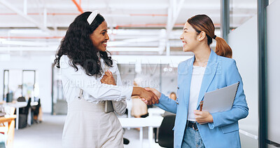 Business women, handshake and welcome, introduction and hello to new intern while walking in office. Happy, excited and diversity workers shaking hands for support, teamwork or onboarding partnership