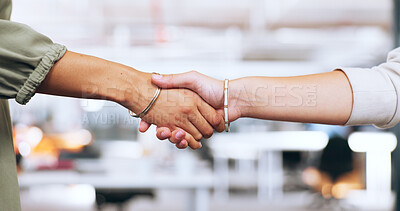 Corporate handshake, closeup and office for woman in agreement, deal or welcome to team in finance startup. Shaking hands, women and thank you for success, contract or partnership for investment goal