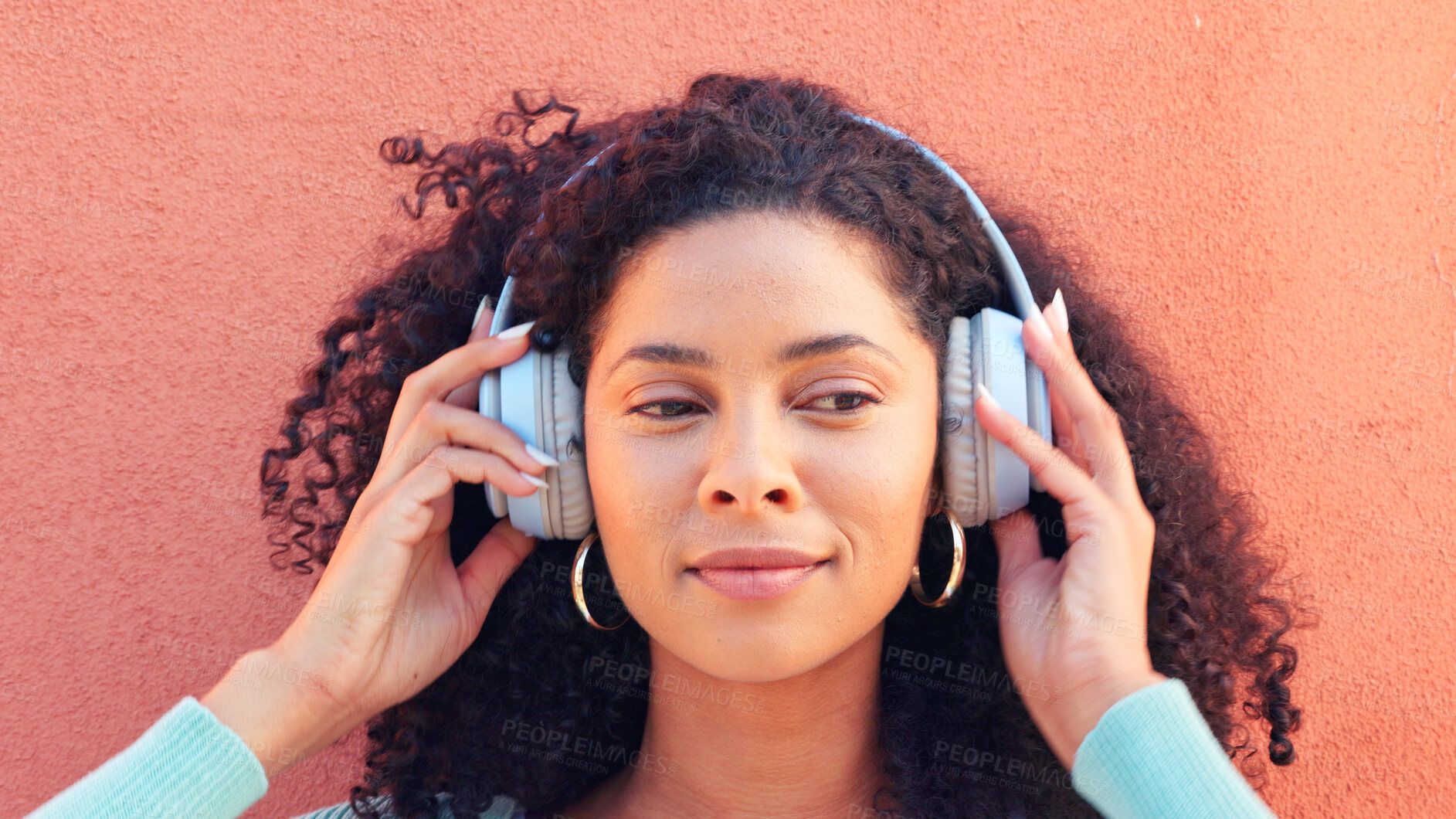 Buy stock photo Music, headphones and woman outdoor with podcast, streaming or subscription on orange background. Radio, earphones and face of female model with audio, track or hearing feel good playlist or album