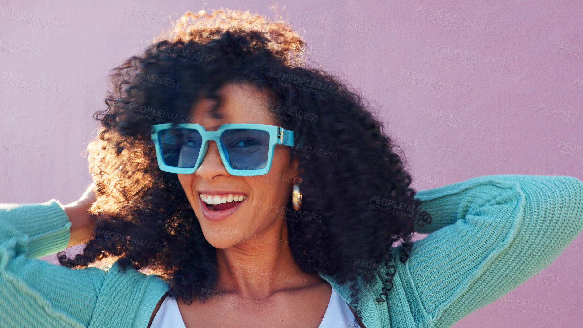 Buy stock photo Black woman, hair and excited portrait with smile on pink background by wall with freedom. Fashion, style and trendy sunglasses with outfit of person with afro hairstyle outdoor haircare and wind