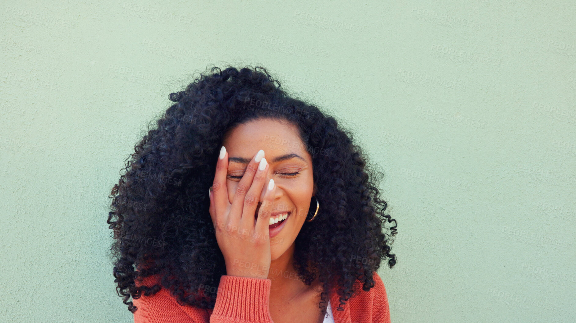 Buy stock photo Woman, funny and wall for natural hair care or curly treatment for beauty, smile of self love. Black female person, smile and happy energy for healthy beauty or wellness results, mockup or background