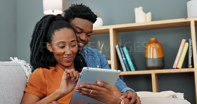 Buy stock photo Love, couch and black couple and tablet watching a video and relax together in the living room. African people, smile and happy from series streaming and funny meme on social media and app on sofa