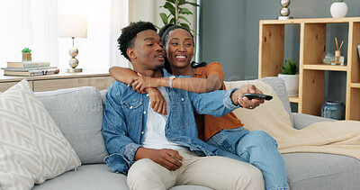 Buy stock photo Happy, love and relax couple change channels on tv remote and watching television together on sofa at home. woman hug on man while enjoying streaming entertainment show, series and movies in house