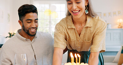 Birthday, cake and couple kiss with celebration, surprise and gift from wife to her husband with love in home. Man and woman celebrating, party and happy together with a present, snack or dessert