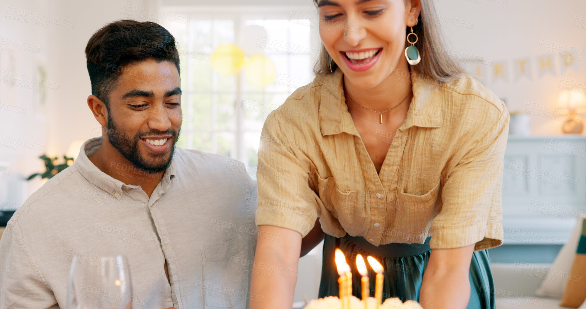 Buy stock photo Cake, birthday candles and interracial couple celebration and party together with love at home. Candles, smile and happy people with dinner date and food in a house with support, giving and care