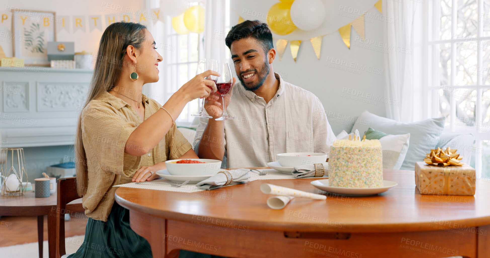 Buy stock photo Birthday cake, wine cheers and romantic dinner with a Italian meal together for celebration. Love, man and woman on date with pasta, dessert and anniversary food happy at dining table at a house