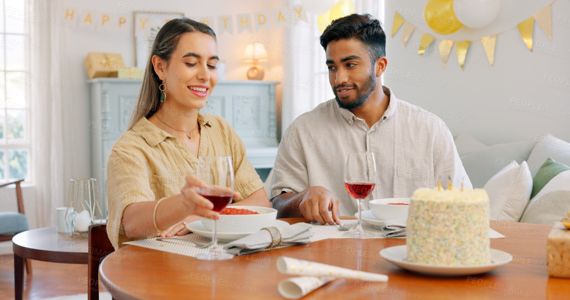 Buy stock photo Birthday cake, wine glass and romantic dinner with a Italian meal together for celebration. Love, man and woman on date with pasta, dessert and anniversary food happy at dining table at a house