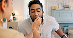 Lunch, happy and couple eating pasta together at a dining room table in their house. Happy, relax and calm woman feeding a comic man food during a dinner date in their home for love and peace