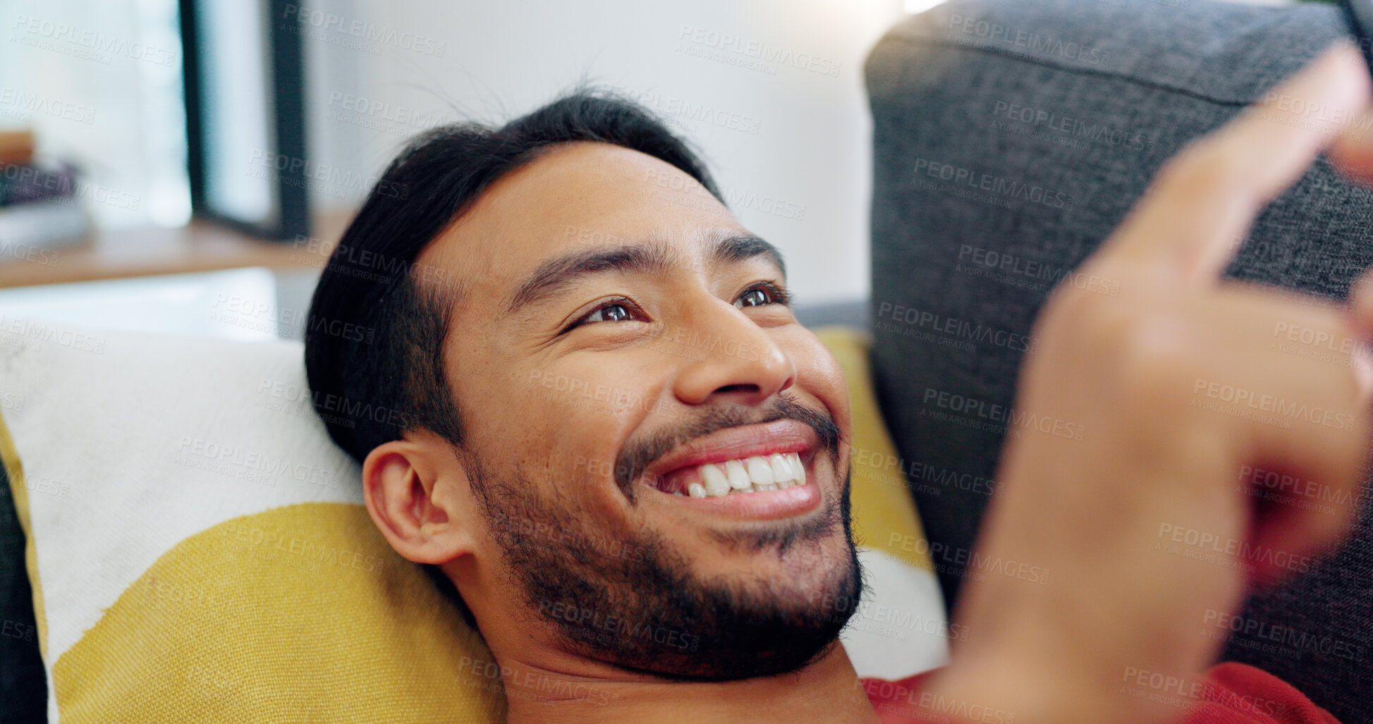 Buy stock photo Sofa, happy and relax man with phone scroll, connection or search social media app for comedy or funny meme. Person, lounge and on a home couch with happiness, mobile typing and reading online comic