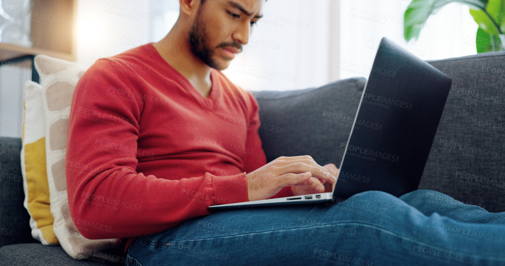 Buy stock photo Stress, anxiety and asian man on laptop on sofa in the living room for research on the internet. Burnout, upset and male person typing on computer for networking on social media in the lounge at home